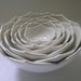 Seven Nesting Lotus Ceramic Bowls in Milk White
