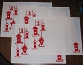 A Set of Four Red Bird Feeder Place Mats