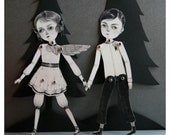November and December articulated paper doll set with 10 silver brads