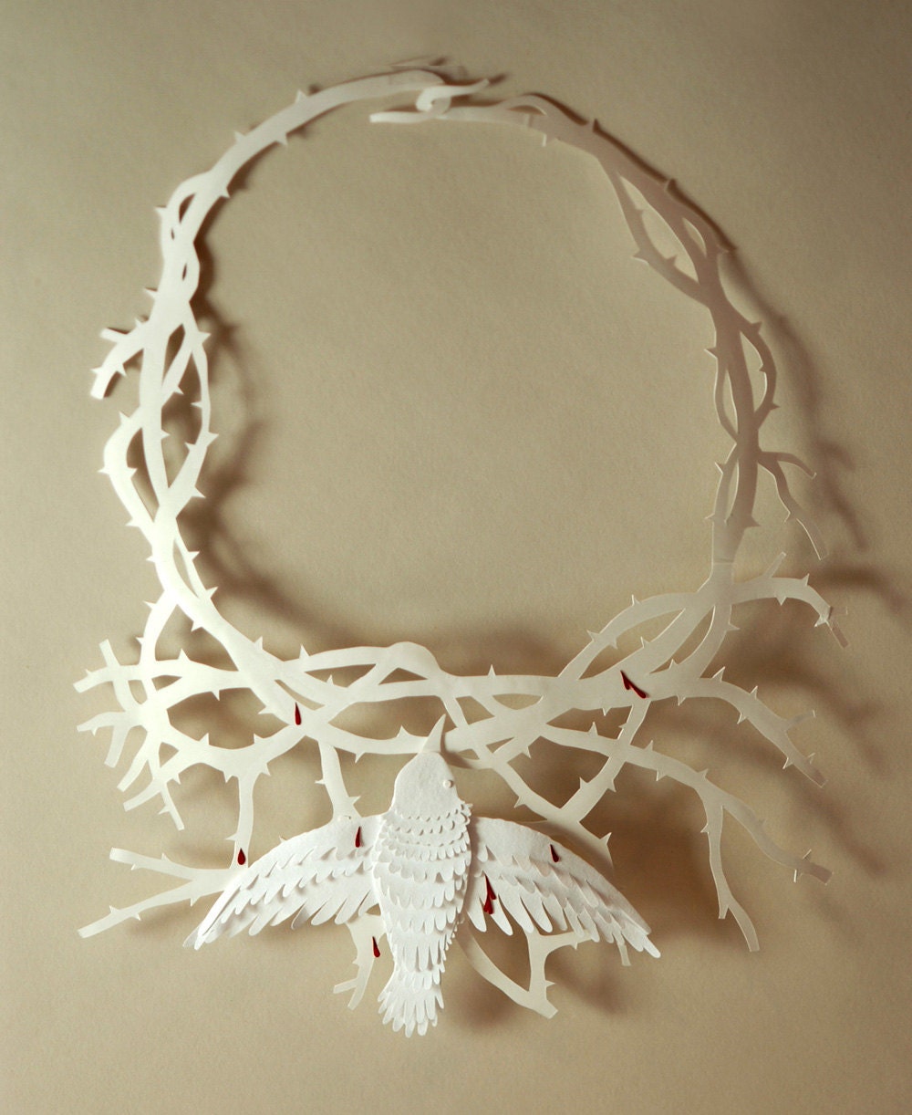 Frida Kahlo inspired necklace made out of acid-free paper. Suitable for framing in a shadow box.