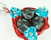 Skull Birds Nest Pendant in Red, Black and Blue