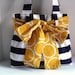 Medium Handbag Made of Navy Blue and White Stripe  Fabric with Yellow  Bow