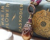 A Single Sun Filled Pearl with Garnet, Gold and Antiqued Brass, June and January Birthstone