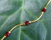 Red Crystal and Gold Tube & Cube Beads Squiggle Necklace