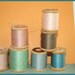 7 wooden spools of vintage thread