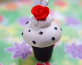 Cupcake charm or pendant. Polymer clay cupcake with black polka dots and red rose