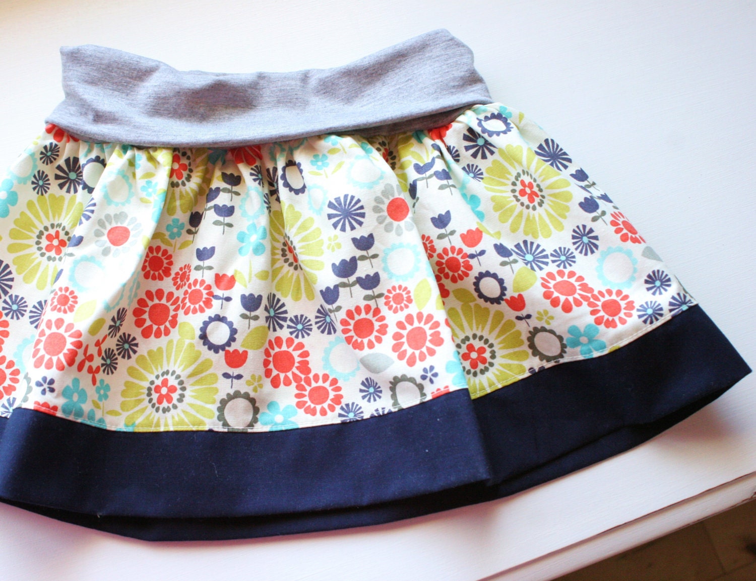 18 mo. Floral Print/Navy Blue Trim Skirt with comfortable knit waistband