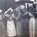 vintage photo Young Ladies Poke Heads through Newspapers