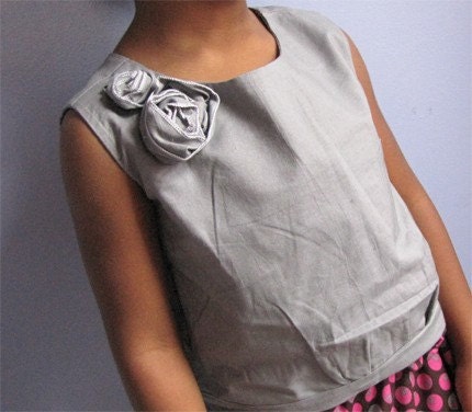 Shell blouse with floral embellishment