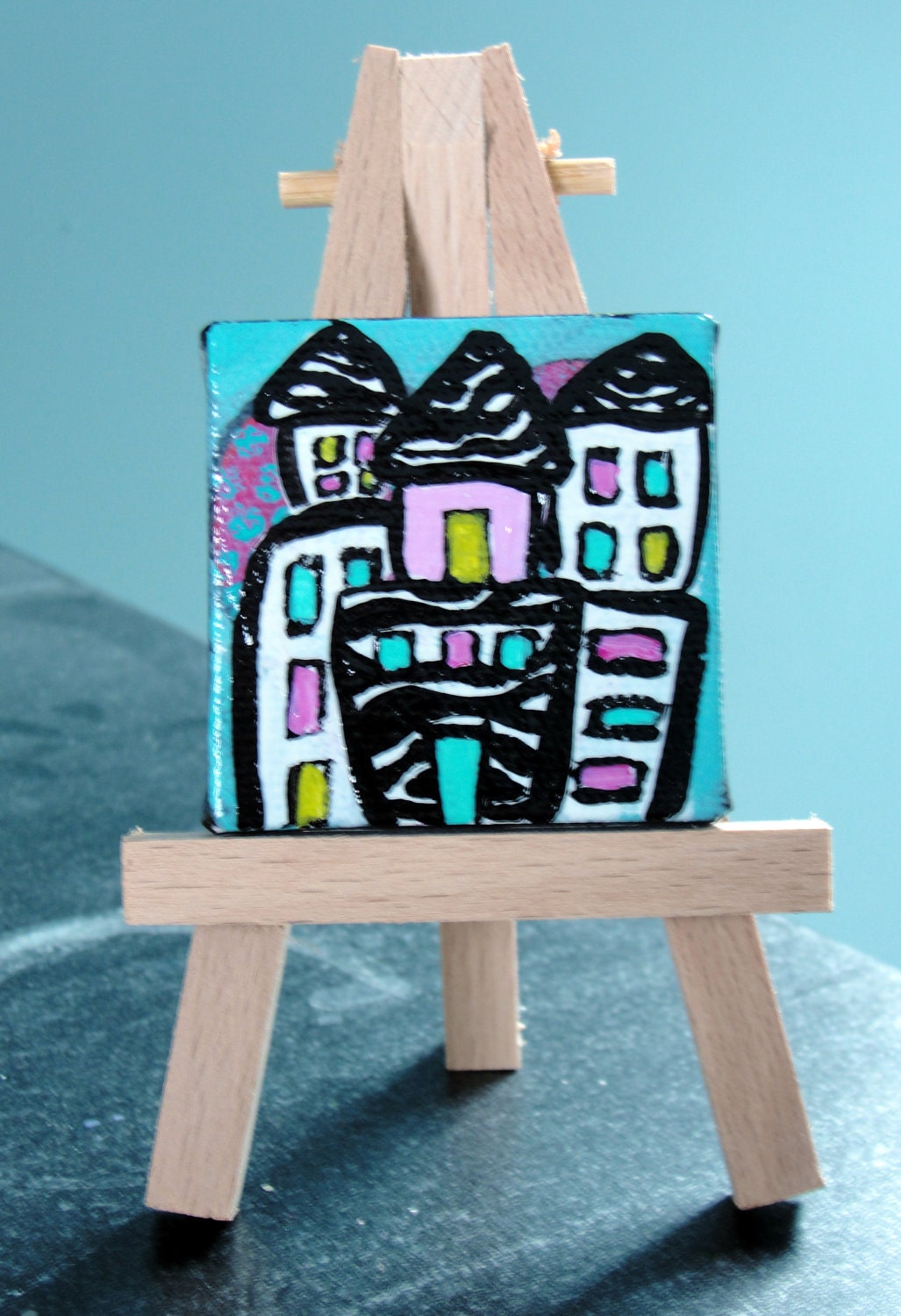 Mini painting of white & zebra print houses with brightly colored windows, great stocking stuffer