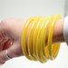 Set of 6 carnival glass bangle bracelets Iridescent yellow pearlescent butterscotch