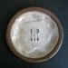brown plate with CUTLERY.