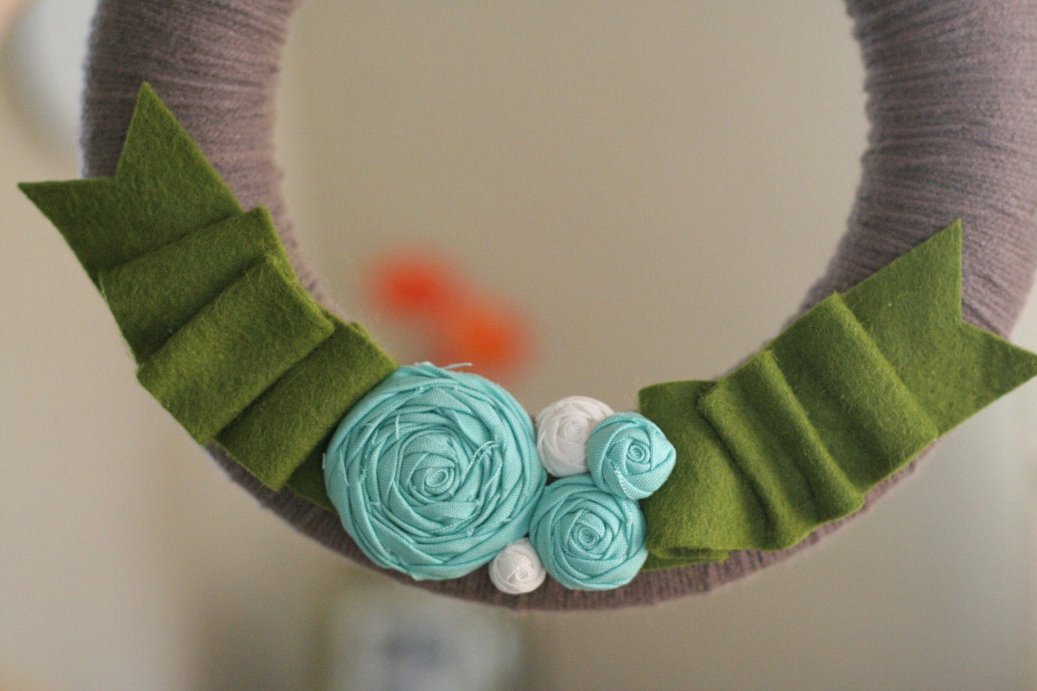 yarn wreath, greenery.