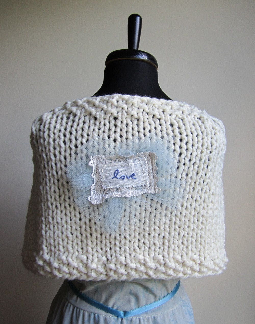 The Love cream knit cape. Ivory. Blue. Vintage Buttons.