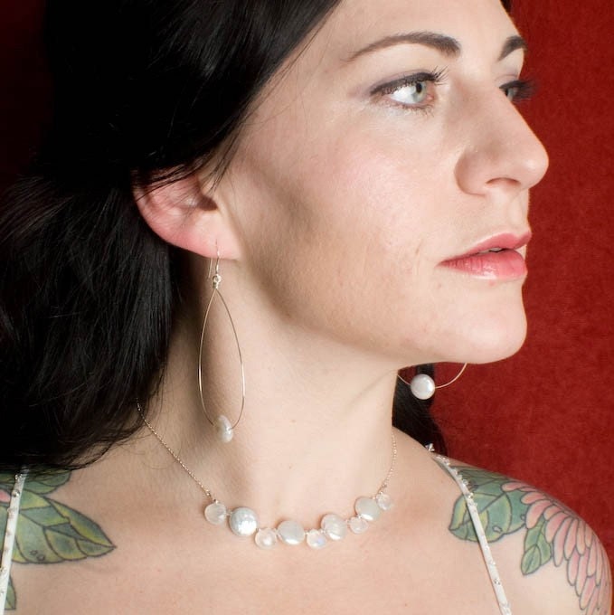 Large hoop earrings with flat coin pearl accent