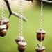 3 sets of golden acorns . ornaments