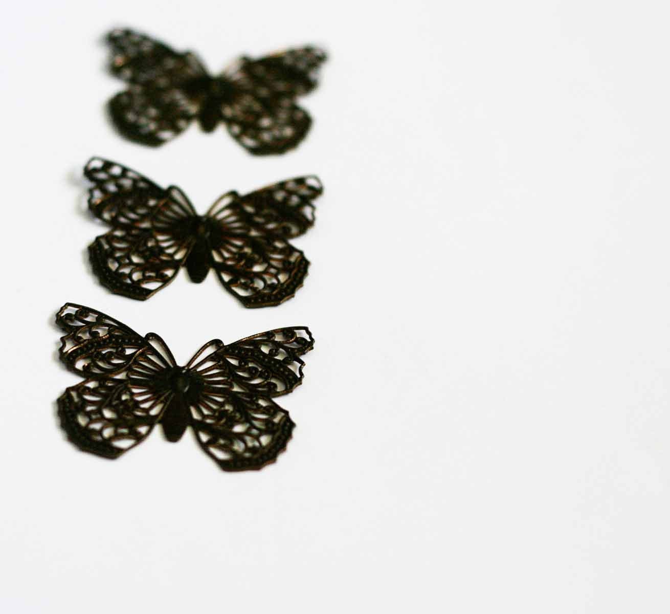 3 Natural brass butterfilies