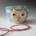 White Cat Yarn Bowl - sculpted kitty against blue sky