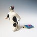 Cat pulling a toy car - hand sculpted ceramic figurine