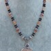 Lolite garnet fossil necklace beautiful pendant all sterling silver comes in a tarnish r pouch