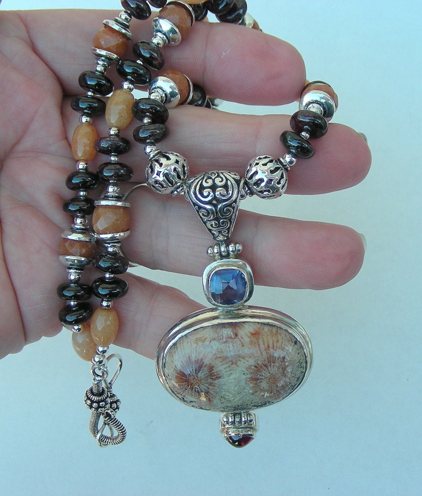 Lolite garnet fossil necklace beautiful pendant all sterling silver comes in a tarnish r pouch