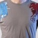 M Angel and Devil T-shirt on Concrete ..... Men's Medium tee