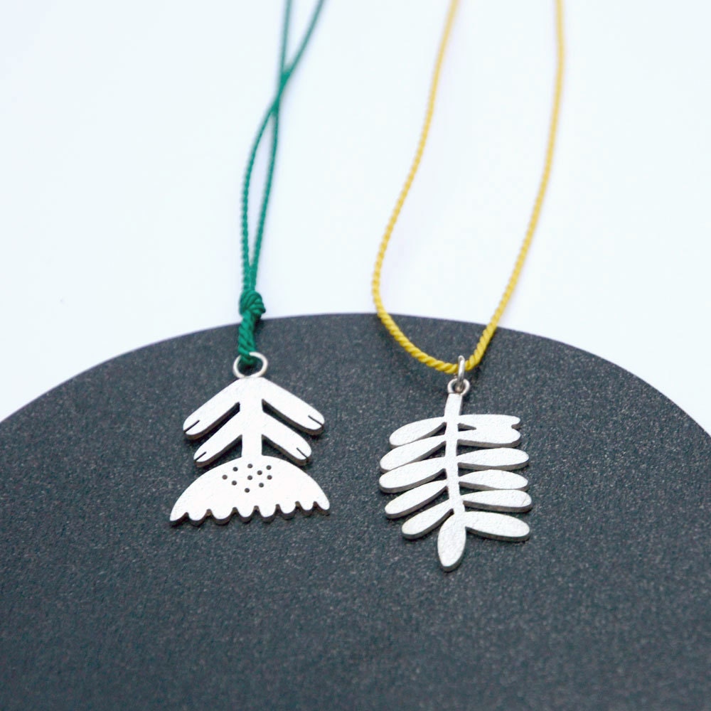 Modern Flower Necklace. Sterling Silver on emerald green Silk