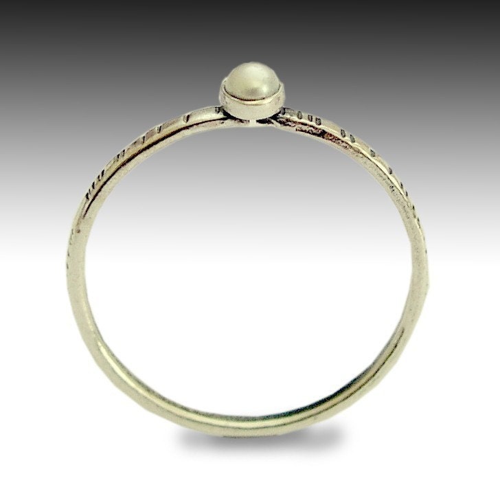 Time out - a tiny, thin, grooved sterling silver band inlaid a fresh water pearl.