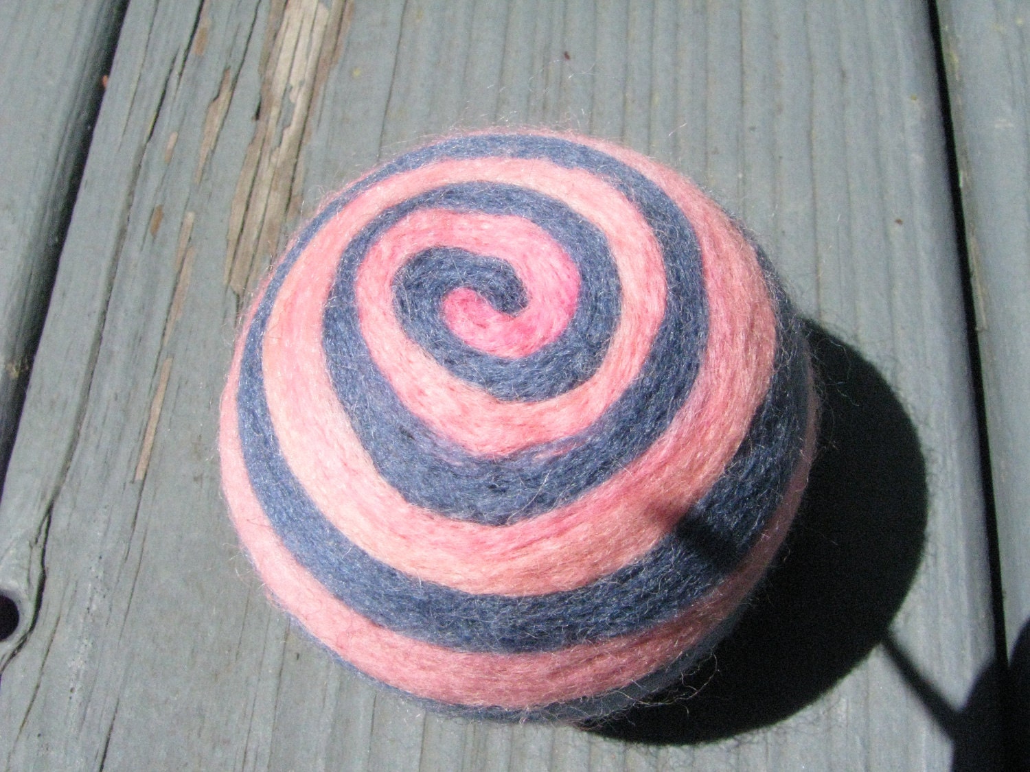 One multi-colored felted pin-cushion, Blue and Hot Pink