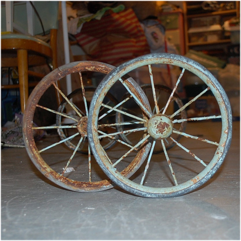 two vintage wheels on axels industrial steam punk supplies