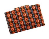 Business card wallet in orange flowers on brown