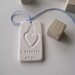 A PROMISE bridal bouquet text tile charm in porcelain with commemorative year 2012