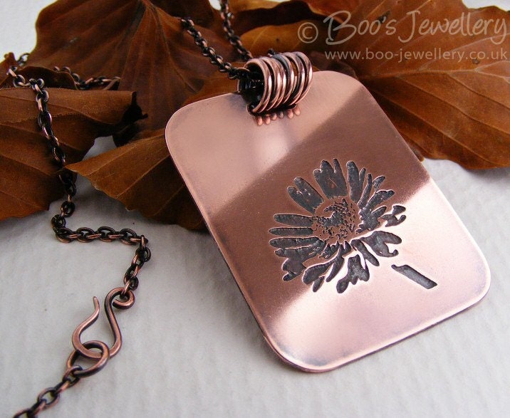 Antiqued copper pendant with etched daisy design