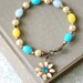 Summer fling.vintage beaded, flower ,aqua blue rhinestone, charm bracelet. tiedupmemories