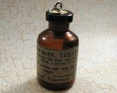 Reproduction vintage Vapor-OL opium patent medicine glass bottle charm