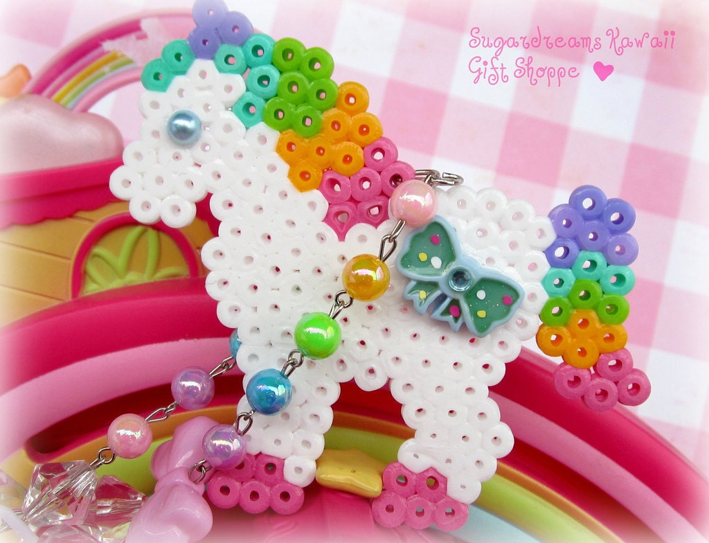 Fairy kei magical rainbow unicorn necklace with blue bow and rainbow and white plastic beaded chain