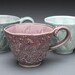 Stamped cup, Rabbits in Grape