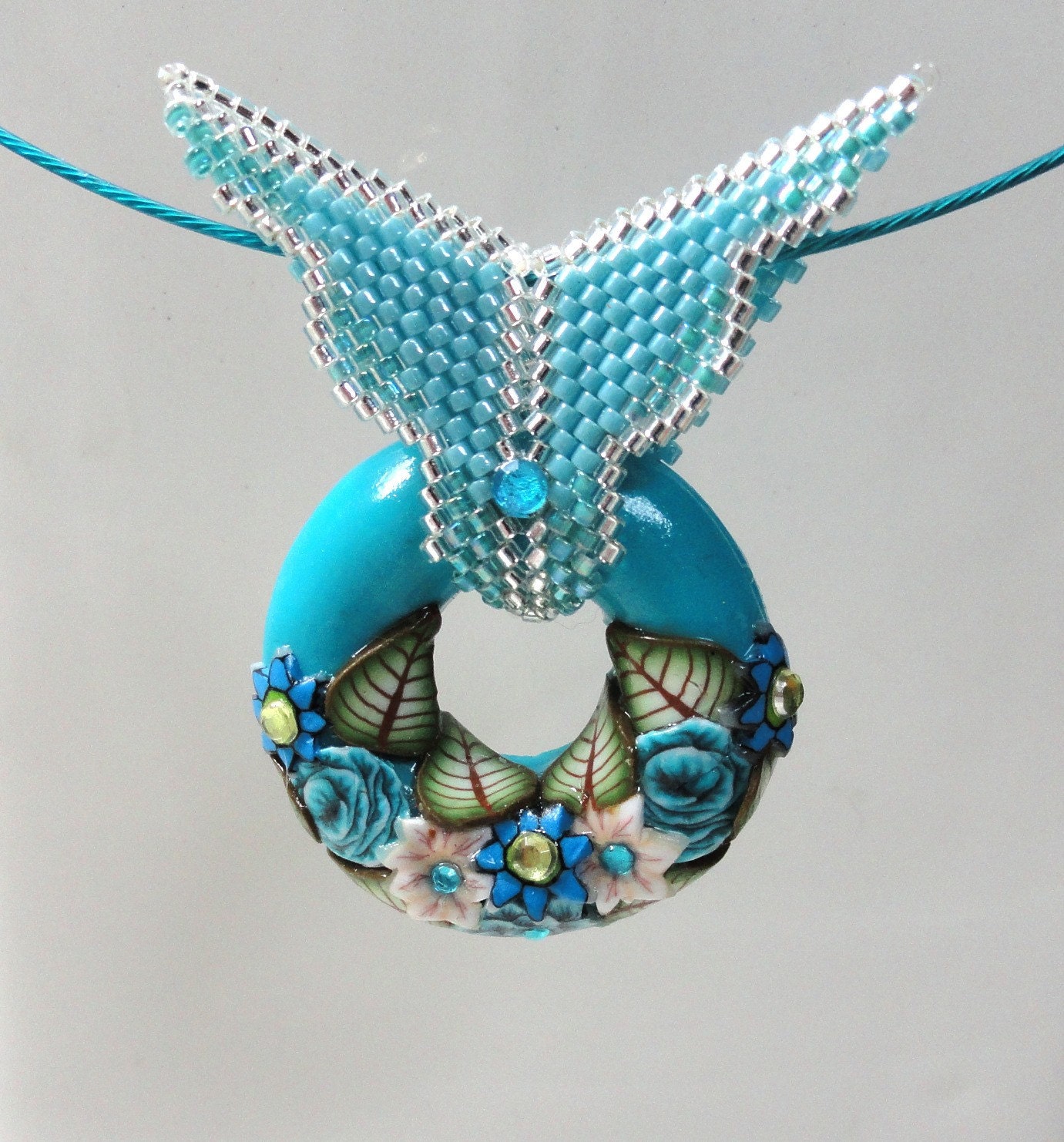 Jewelry Pendant Handmade of  Polymer clay in  Bagel Shape. Turquoise Beadwork by Artefyk