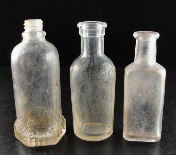 Lot of three Antique Miniature Glass Bottles by KCAT