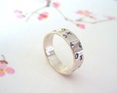 Big kisses and hugs- x and o stamped silver ring-medium width