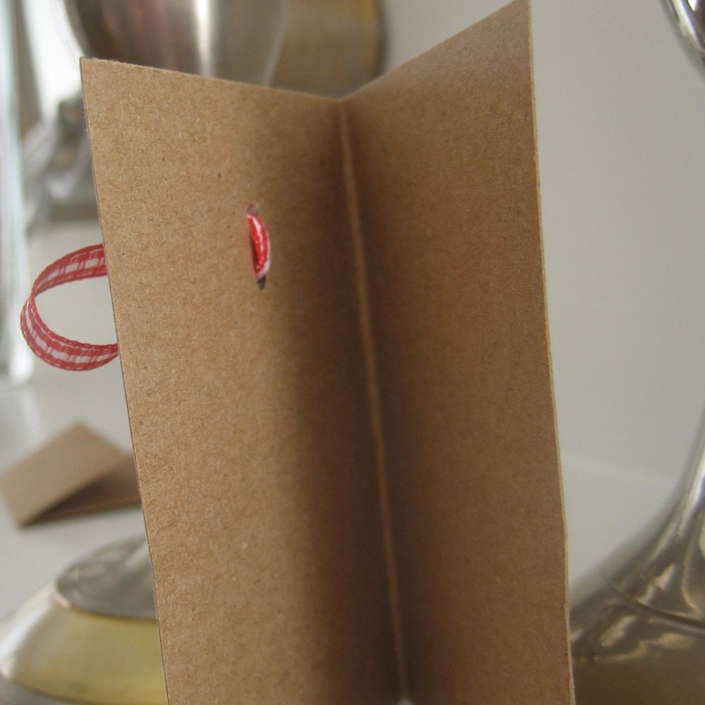 reserved handmade gift enclosure card kraft with wreath and red gingham ribbon bow