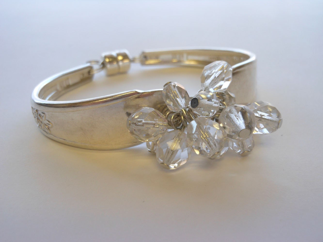 Silverware handle bracelet with clear bead cluster