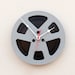 Clock made from a recycled magnetic tape reel