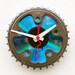 Clock made from a recycled Bike chainring and a DVD