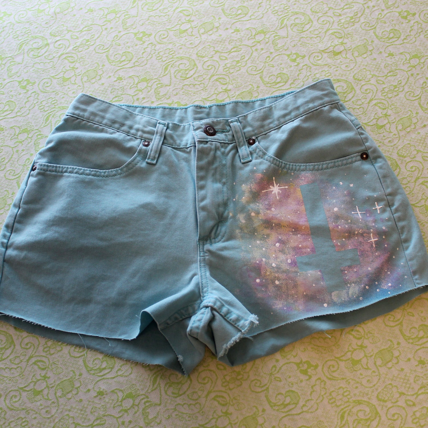 pastel teal galaxy shorts with inverted cross
