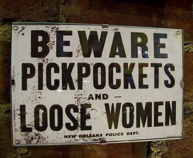 retro vintage beware pickpockets and loose women sign
