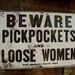 retro vintage beware pickpockets and loose women sign