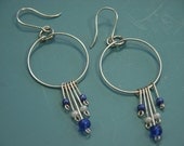 Pair of handworked silver metal earrings/earhangings made in metalwork technique