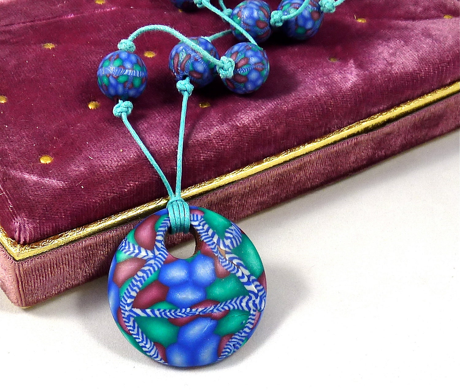 Very Interesting Polymer Clay Necklace in Blue, Green and Burgundy with Zebra Stripe Design