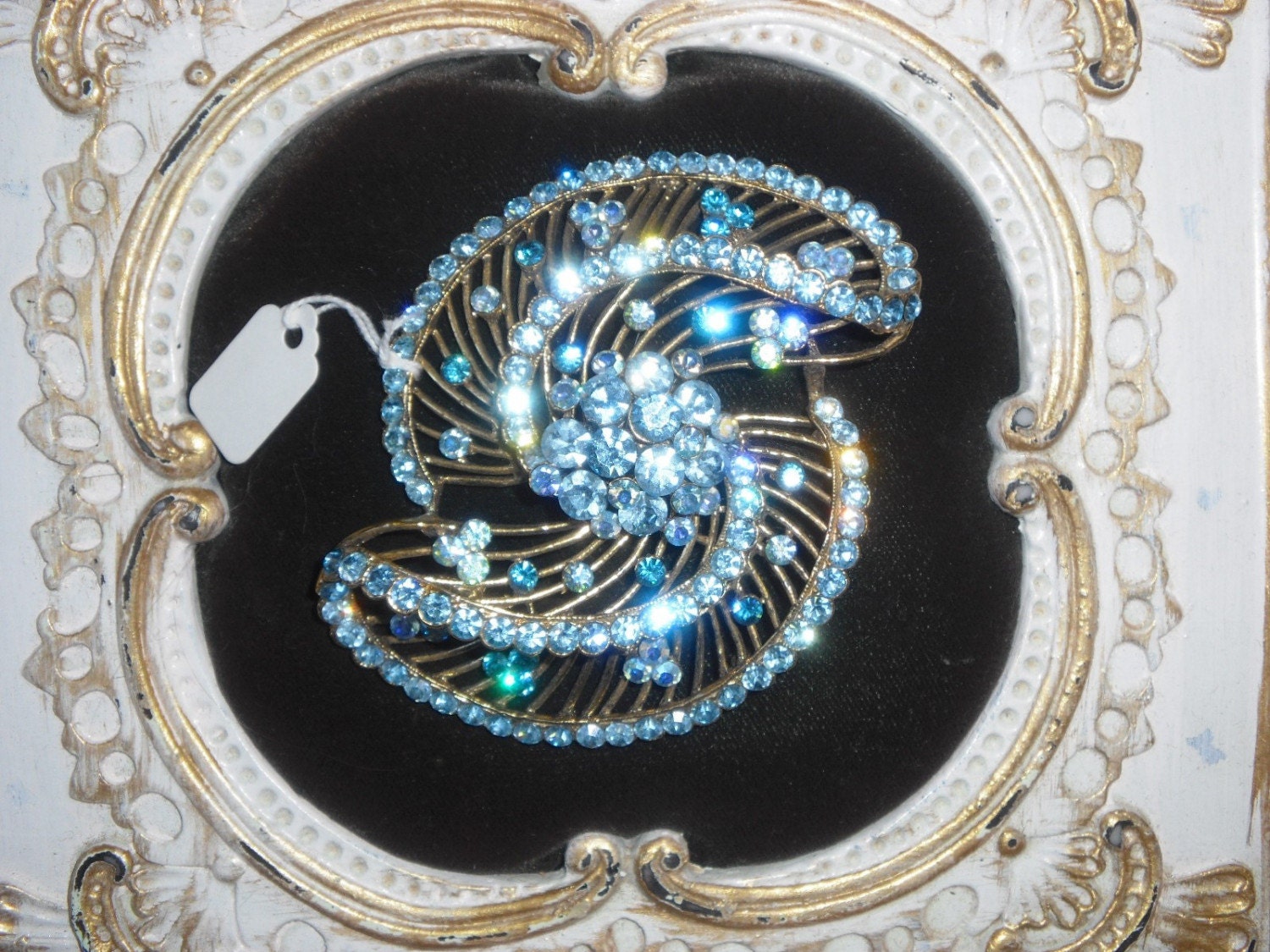 Huge Vintage Baby Blue Rhinestone Swirled Brooch 3 and one half inches long Goldtone Setting